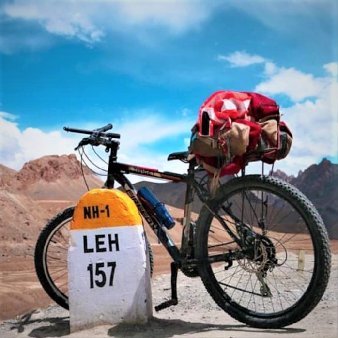 Cycle standing near milestone of LEH