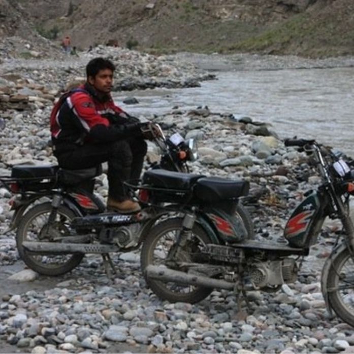 rider sitting on Moped in Leh